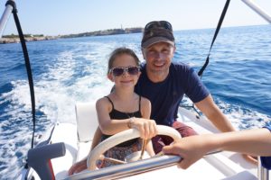 Sylvie captains the boat in Mallorca, Spain. 